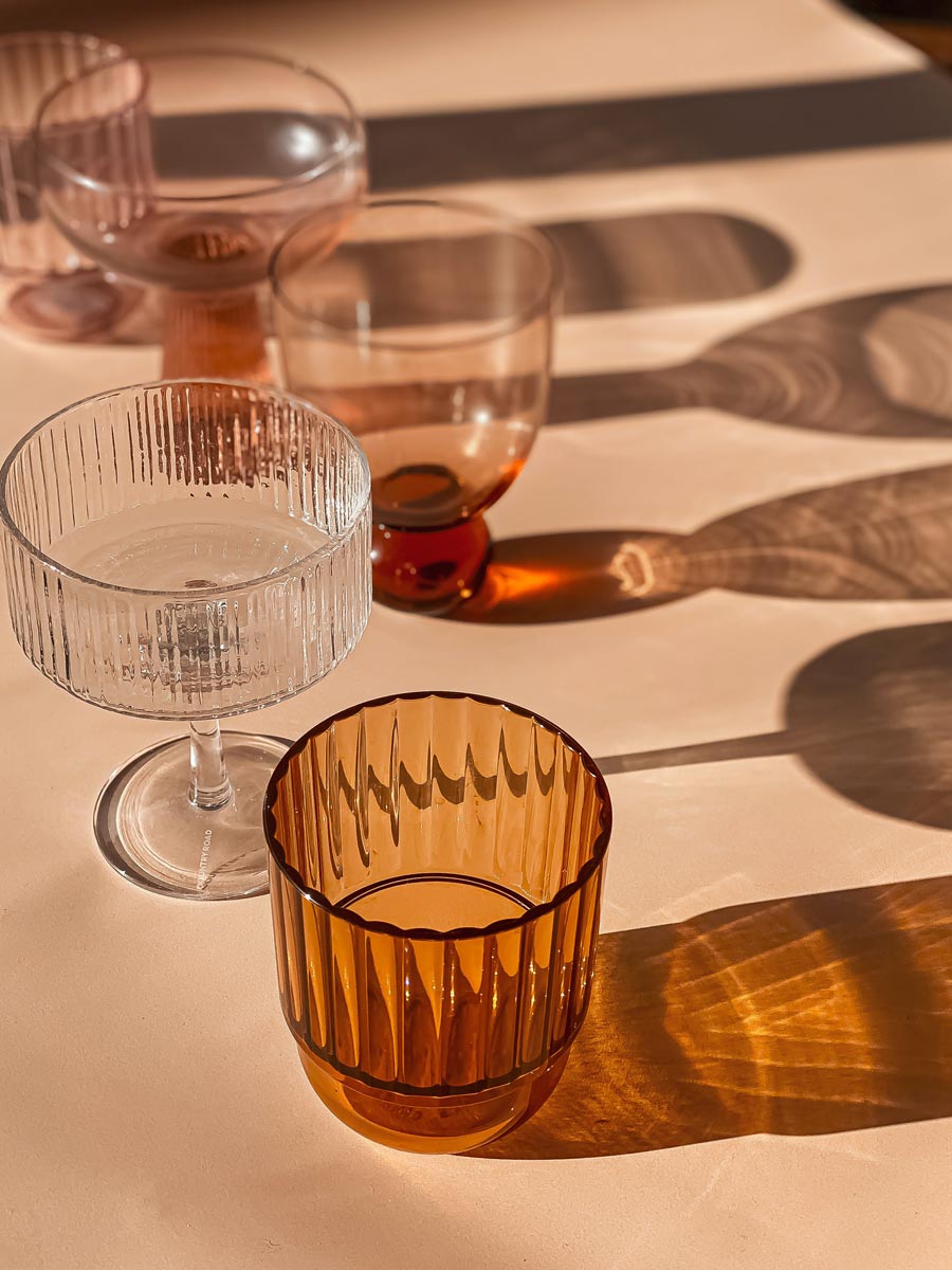 Untitled design Woman Holding Cup Standing in the Kitchen